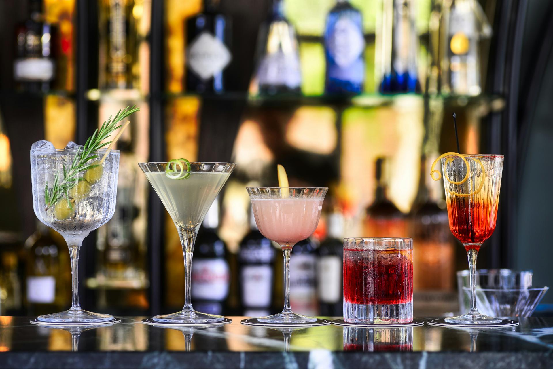 line-of-cocktails-on-a-bar